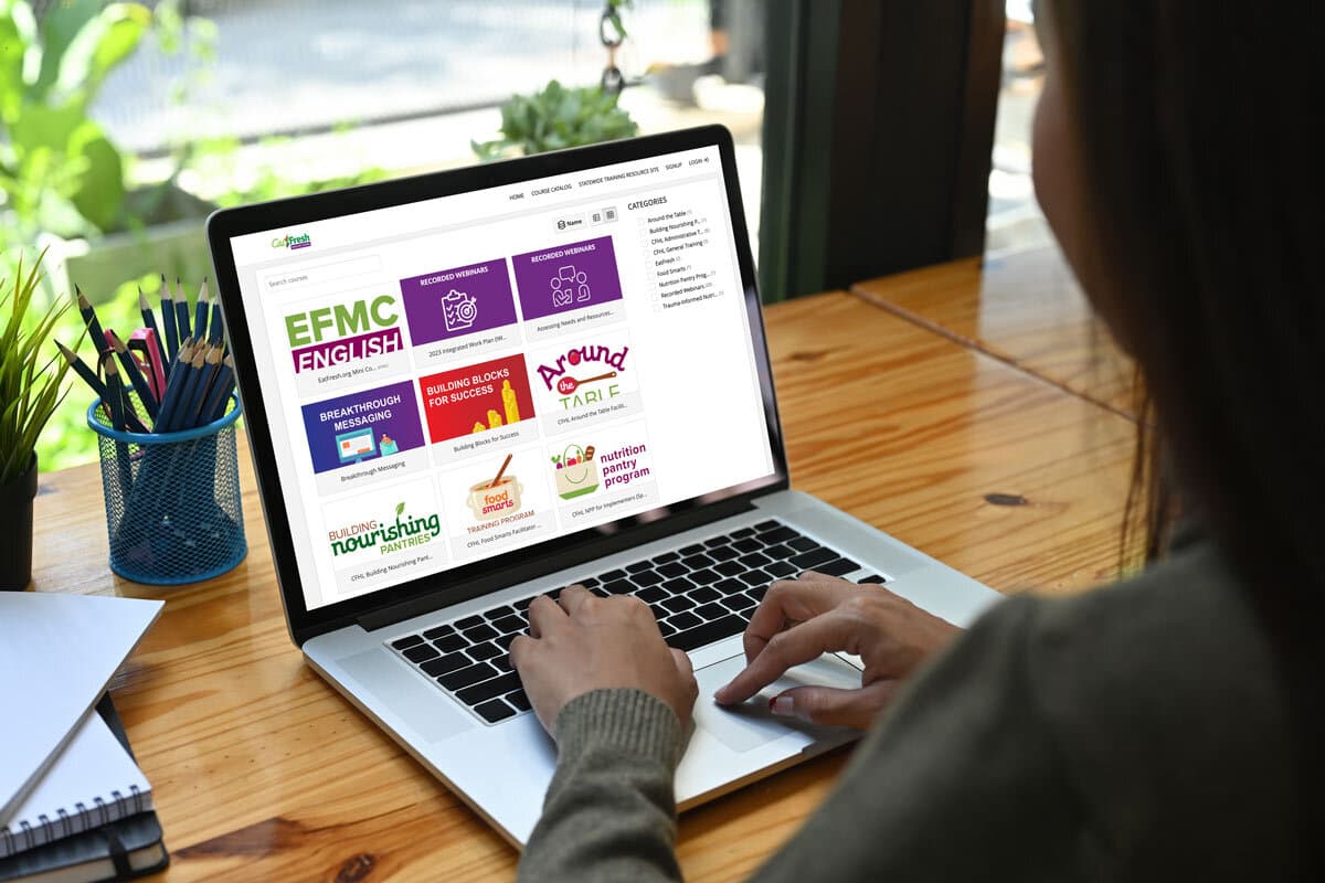 person browsing CFHL website on a laptop